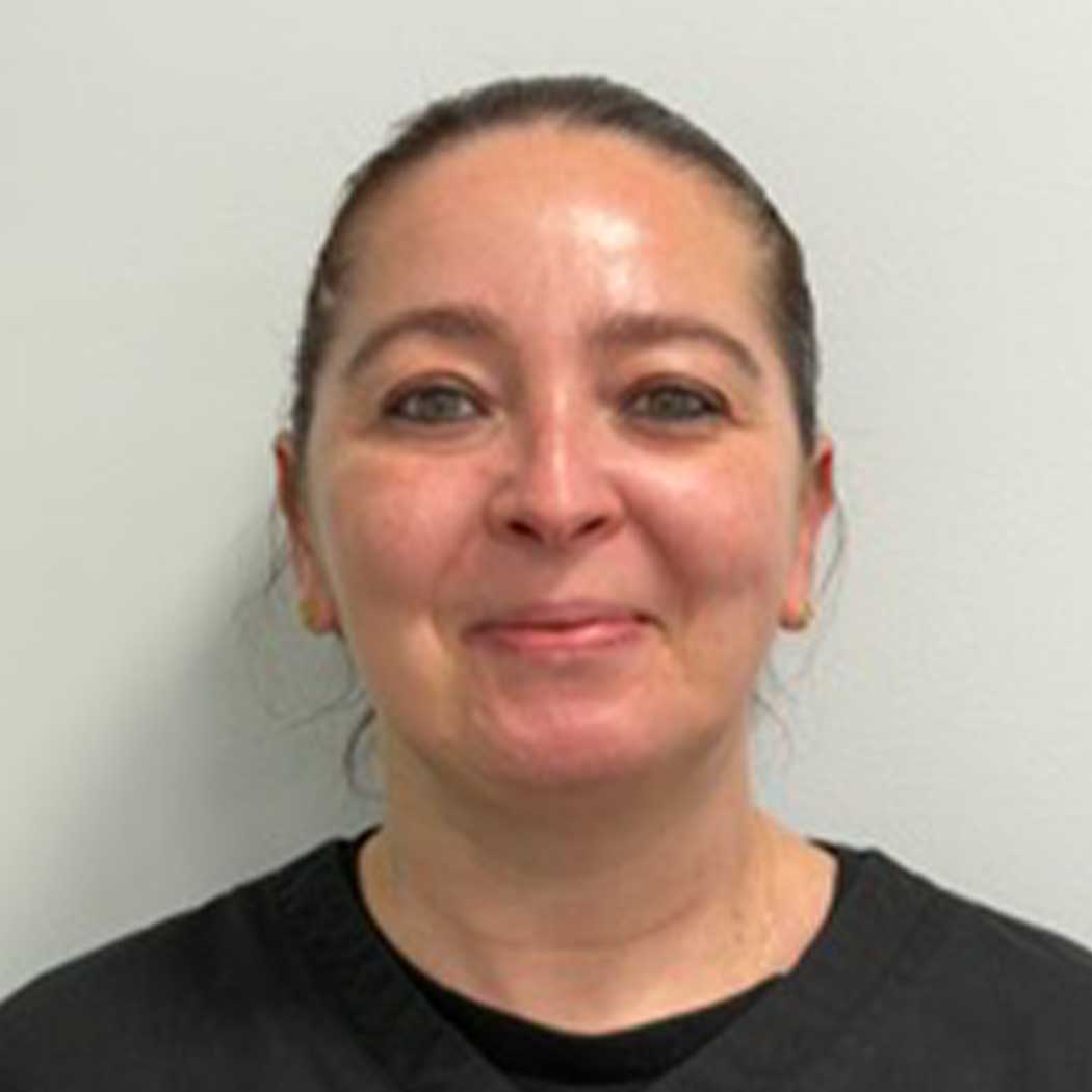 Person wearing a black shirt against a plain background