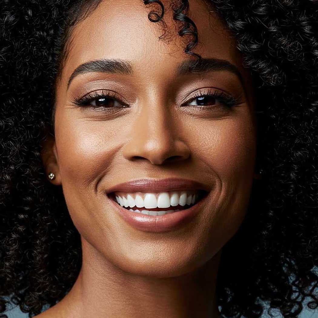 Close-up of a woman with a bright smile